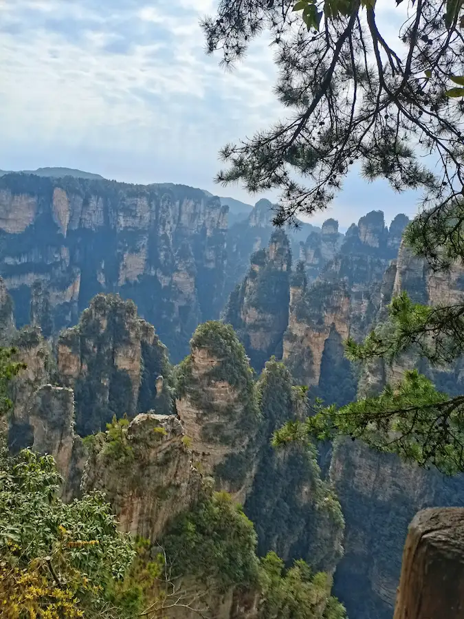How to get to Zhangjiajie — misty sandstone peaks at sunrise, Wulingyuan