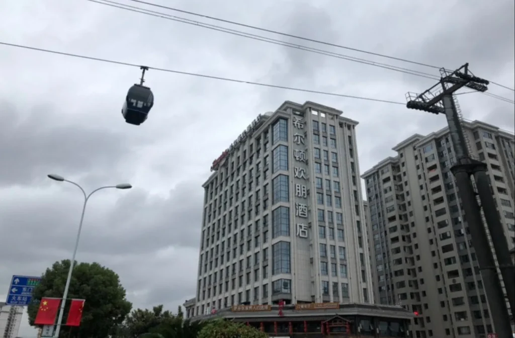 Hampton by Hilton Zhangjiajie Tianmen Mountain exterior next to cable car ropeway